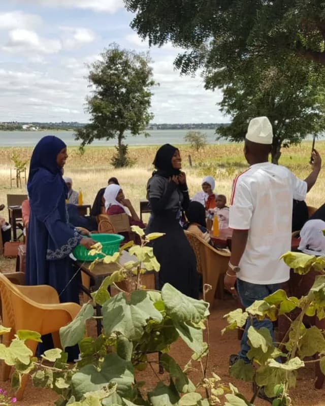 A community lunch outdoors by the lake in Tanzania